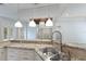 Updated kitchen featuring granite countertops, stainless sink, and modern fixtures at 4946 Brywill Cir, Sarasota, FL 34234