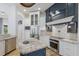 Modern kitchen with stainless appliances, granite counters, custom cabinets, and stylish backsplash at 4946 Brywill Cir, Sarasota, FL 34234
