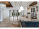 Spacious gourmet kitchen featuring granite countertops, stainless steel appliances, pendant lighting, and travertine floors at 4946 Brywill Cir, Sarasota, FL 34234
