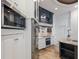 Bright, updated kitchen with modern appliances, custom cabinetry, and center island at 4946 Brywill Cir, Sarasota, FL 34234