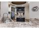 Gourmet kitchen with granite countertops, stainless steel appliances, and a large island with seating at 4946 Brywill Cir, Sarasota, FL 34234