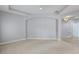 Spacious living room with neutral carpet and decorative archways at 4946 Brywill Cir, Sarasota, FL 34234