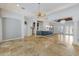 Open-concept living space showcases tile flooring, modern lighting, and easy kitchen access at 4946 Brywill Cir, Sarasota, FL 34234