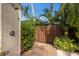 Outdoor shower surrounded by lush tropical foliage, featuring brick pathway at 4946 Brywill Cir, Sarasota, FL 34234