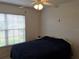 Bedroom with double bed and window blinds at 5115 44Th St W, Bradenton, FL 34210