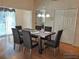 Bright dining room with seating for six and access to the living room at 5115 44Th St W, Bradenton, FL 34210