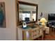 Living room with a large mirror and decorative furniture at 5115 44Th St W, Bradenton, FL 34210