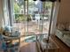 Living room with patio access and wicker furniture at 5115 44Th St W, Bradenton, FL 34210