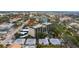 Aerial view showing condo building, pool, and parking at 512 W Venice Ave # 401, Venice, FL 34285