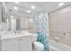Clean bathroom with white vanity and walk-in shower at 512 W Venice Ave # 401, Venice, FL 34285