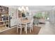 Community room with table, chairs, and bookcases at 512 W Venice Ave # 401, Venice, FL 34285