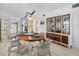Bright dining area with a wood table and chairs, built-in hutch and kitchen view at 512 W Venice Ave # 401, Venice, FL 34285