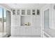 White kitchen cabinets and countertops, offering ample storage at 512 W Venice Ave # 401, Venice, FL 34285
