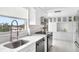 Stylish kitchen featuring white cabinetry and stainless steel appliances at 512 W Venice Ave # 401, Venice, FL 34285