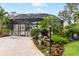 Community pool with screened enclosure and landscaping at 512 W Venice Ave # 401, Venice, FL 34285