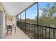 Spacious screened balcony overlooks lush landscape and pool at 512 W Venice Ave # 401, Venice, FL 34285