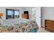 Comfortable bedroom with ocean views and balcony access at 5201 Gulf Of Mexico Dr # 103, Longboat Key, FL 34228