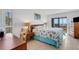 Bright bedroom with ocean view and ensuite access at 5201 Gulf Of Mexico Dr # 103, Longboat Key, FL 34228