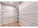 Spacious walk-in closet with ample shelving and hanging rods at 5509 Coachwood Cv, Bradenton, FL 34211