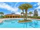 Stunning pool with a tropical island feature at 5509 Coachwood Cv, Bradenton, FL 34211