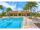 Resort-style pool with lounge chairs and a clubhouse at 5509 Coachwood Cv, Bradenton, FL 34211