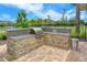 Community outdoor kitchen with granite countertops at 5509 Coachwood Cv, Bradenton, FL 34211