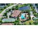 Community clubhouse with pool, tennis courts and green space at 5846 Cavano Dr, Sarasota, FL 34231