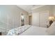 Bright bedroom with a queen bed, large closet, and ensuite bathroom at 5846 Cavano Dr, Sarasota, FL 34231