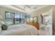 Spacious bedroom with large window and ensuite access at 5846 Cavano Dr, Sarasota, FL 34231