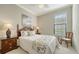 Calm bedroom with window and wood furniture at 5846 Cavano Dr, Sarasota, FL 34231