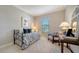 Charming bedroom with daybed, window seat, and ample natural light at 5846 Cavano Dr, Sarasota, FL 34231