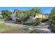 House exterior with paved pathway and manicured landscaping at 5846 Cavano Dr, Sarasota, FL 34231