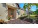 Inviting front entry with a decorative door and brick walkway at 5846 Cavano Dr, Sarasota, FL 34231