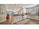Well-equipped kitchen, featuring white shaker cabinets and granite countertops at 5846 Cavano Dr, Sarasota, FL 34231