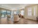 Bright living room features hardwood floors and access to a patio at 5846 Cavano Dr, Sarasota, FL 34231
