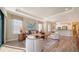 Open living space with hardwood floors, and views of kitchen at 5846 Cavano Dr, Sarasota, FL 34231