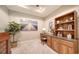 Home office with built-in desk and shelving at 5846 Cavano Dr, Sarasota, FL 34231