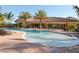 Community pool with a spa and lounge area at 5846 Cavano Dr, Sarasota, FL 34231
