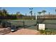 Community tennis court with seating at 5846 Cavano Dr, Sarasota, FL 34231