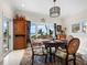 Ocean view dining room with antique table and chairs at 6161 Gulf Of Mexico Dr, Longboat Key, FL 34228