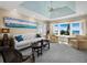 Living room boasts ocean views, comfortable seating, and a tray ceiling at 6161 Gulf Of Mexico Dr, Longboat Key, FL 34228