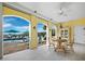 Outdoor patio with seating area overlooking the pool and ocean at 6161 Gulf Of Mexico Dr, Longboat Key, FL 34228