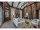 Living area boasts wood features, stone fireplace, and views into the kitchen at 6200 Saddle Oak Trl, Sarasota, FL 34241