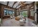 Open living room with high ceilings, wood beams, and a cozy seating area at 6200 Saddle Oak Trl, Sarasota, FL 34241