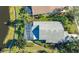 Aerial view highlighting the home's roof and pool at 6523 Virginia Xing, University Park, FL 34201
