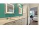Elegant bathroom with a double vanity and large mirrors at 6523 Virginia Xing, University Park, FL 34201