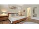 Main bedroom with ensuite bathroom and modern decor at 6523 Virginia Xing, University Park, FL 34201