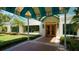 Inviting entrance to The Varsity Club with a covered walkway at 6523 Virginia Xing, University Park, FL 34201