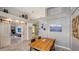 Bright dining area with wood table and chairs, open to kitchen at 6523 Virginia Xing, University Park, FL 34201
