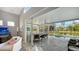 Spacious enclosed pool and spa area with outdoor kitchen and seating at 6523 Virginia Xing, University Park, FL 34201